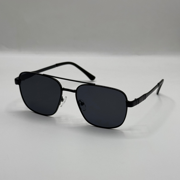 Black sunglasses on a light gray background
