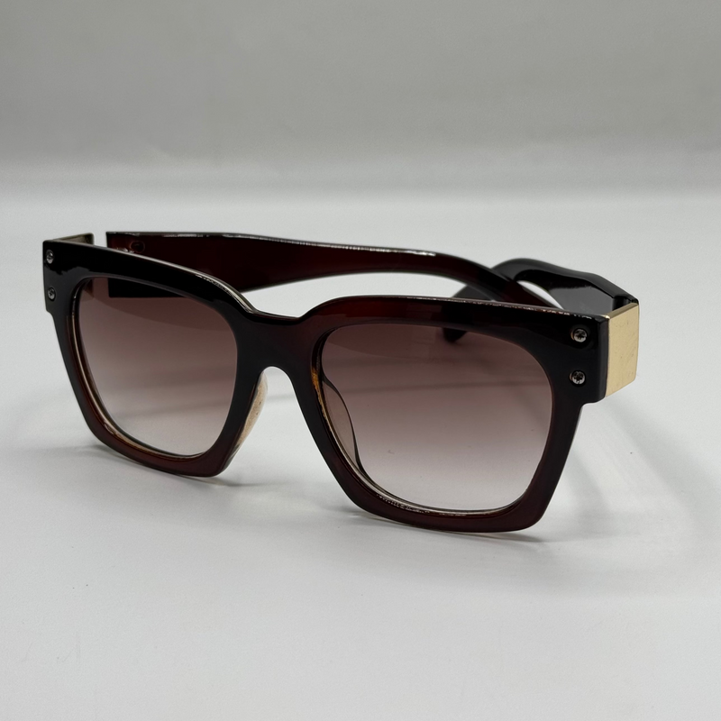 Sunglasses with a brown frame and gradient lenses on a light gray background